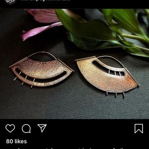 Asymmetrical copper and silver fans